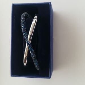 Swarovski crystaldust cross cuff with blue crystals. Box included.
